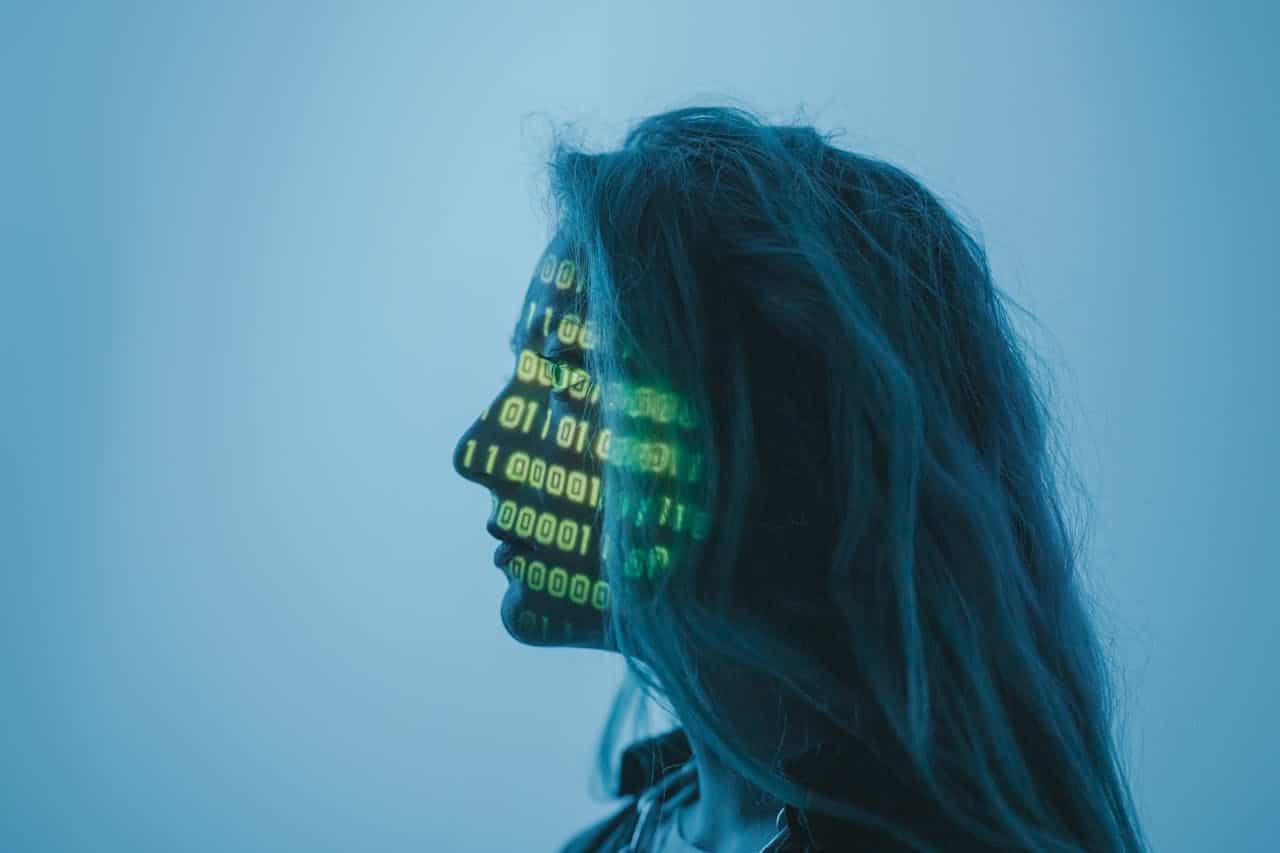 Crafting Captivating Headlines: Your awesome post title goes here Silhouette of a woman with binary code projected on her face in a digital concept setting.